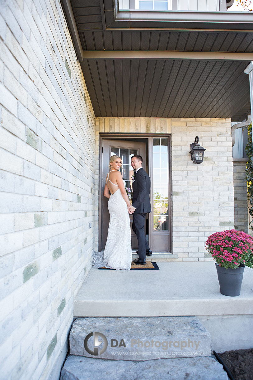 Groom walking his bride in their house