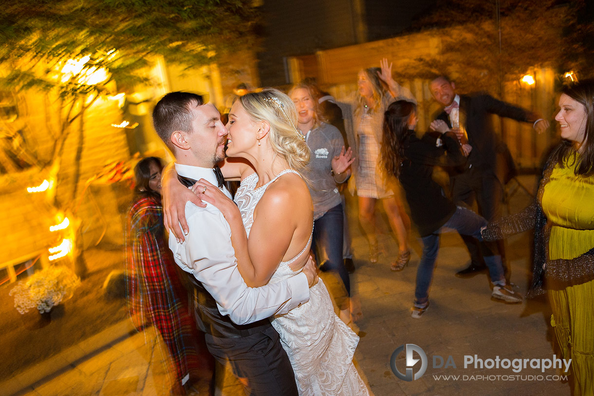 Bride and groom on the dance floor in a backyard wedding