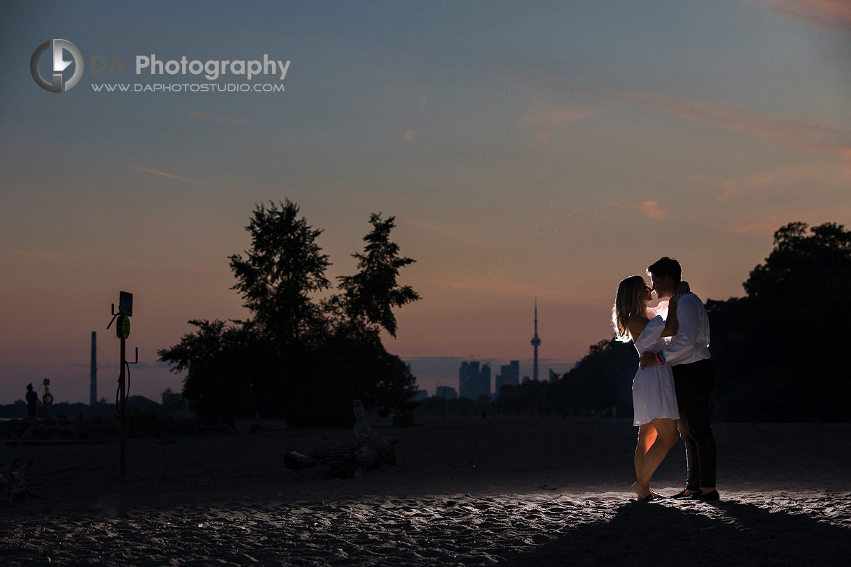 Couples nighttime photos with CN Tower at their back