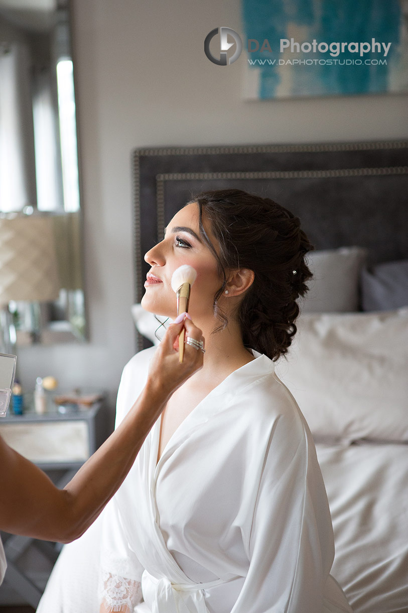 Bride getting makeup done in Oakville