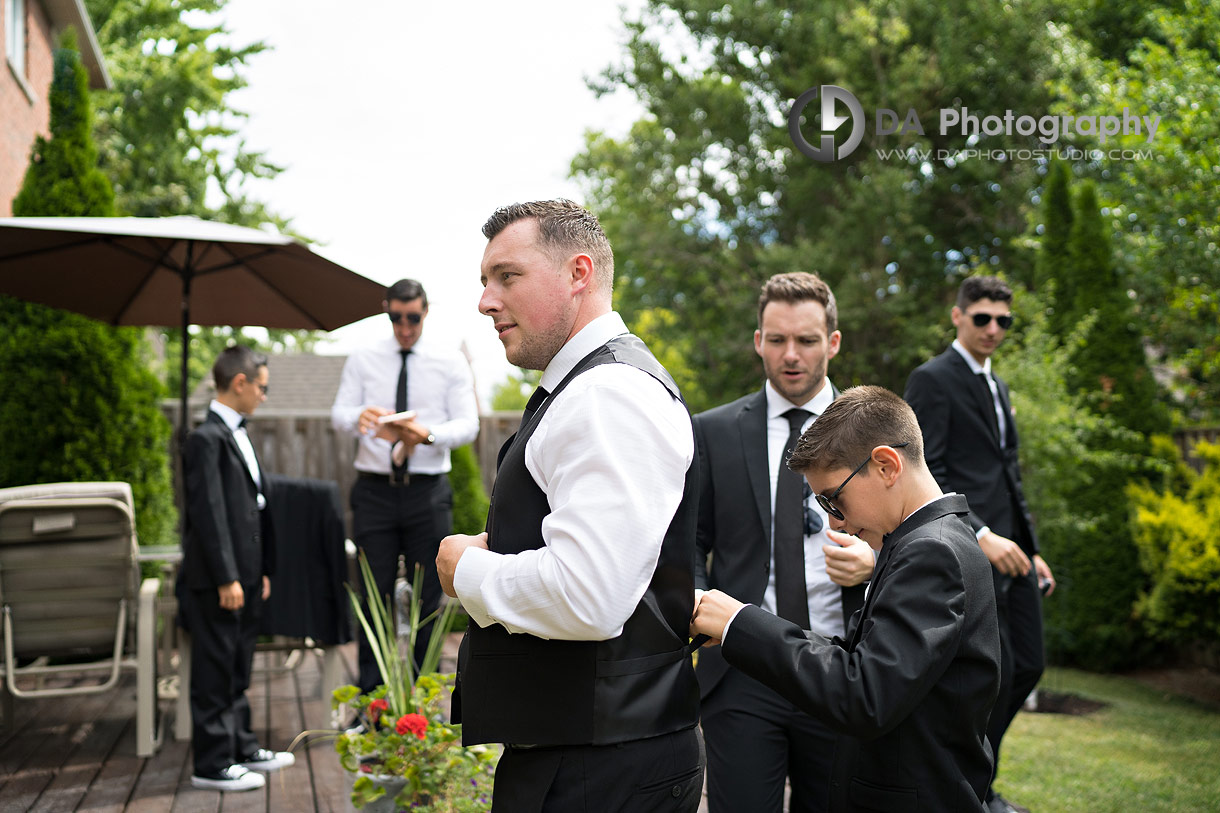 Groom getting ready in a garden