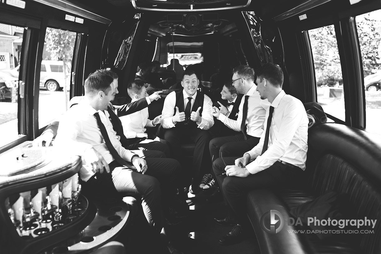 Photo of groom with his groomsman in a limo