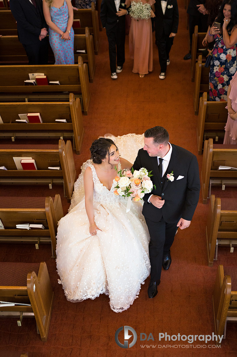 Bride and Groom exiting church in Oakville