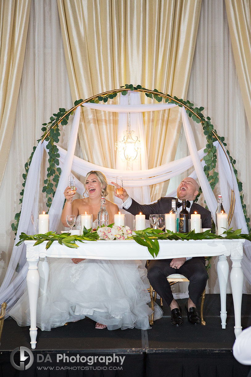 Bride and Groom on the head table at Chateau Le Jardin Wedding Reception