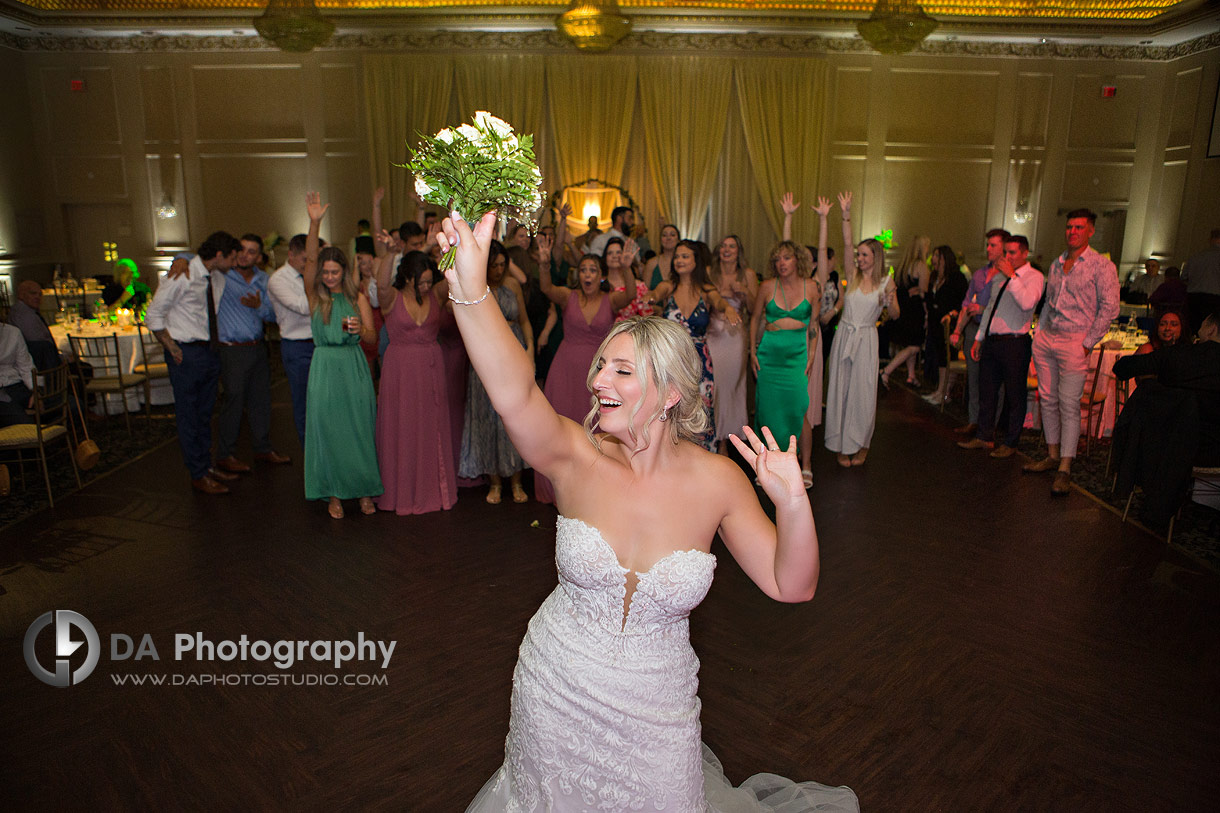 Bride getting ready to throw her wedding bouquet at Chateau Le Jardin