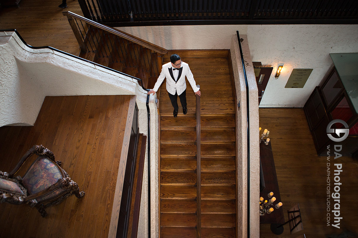 Groom on stairs at Casa Loma