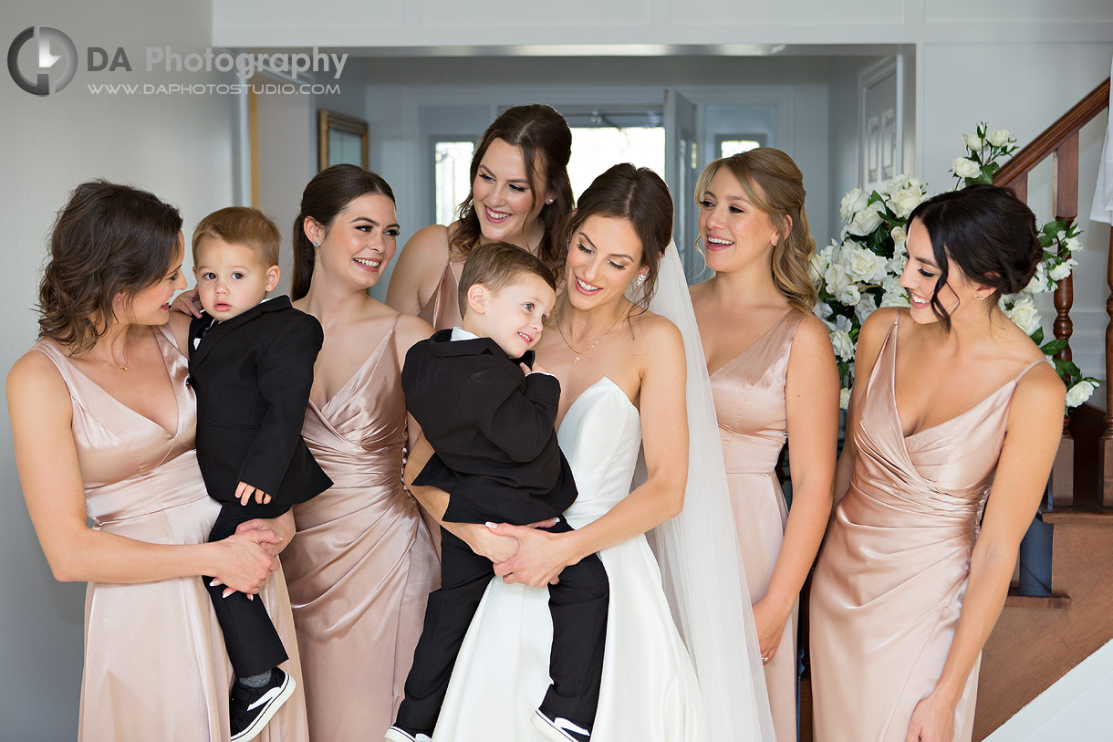 Photo of a Bridesmaids with the ring bearers 