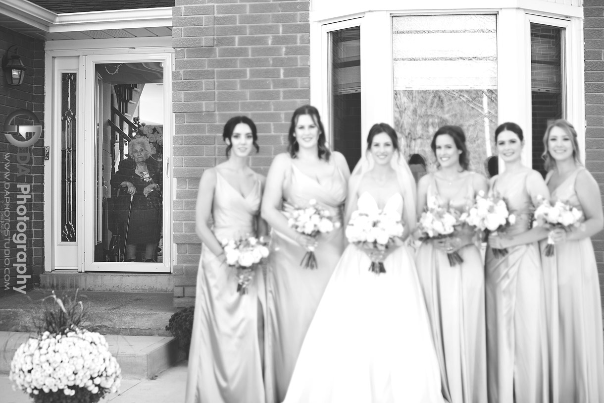 Grandmother watching the bridesmaids getting photographed 