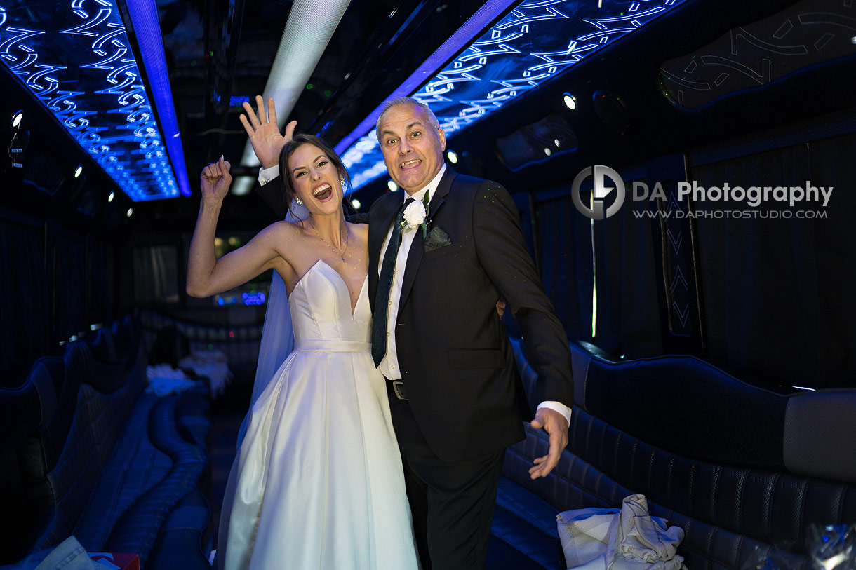 Fun photo of a bride with her dad in a limo prior the the wedding ceremony