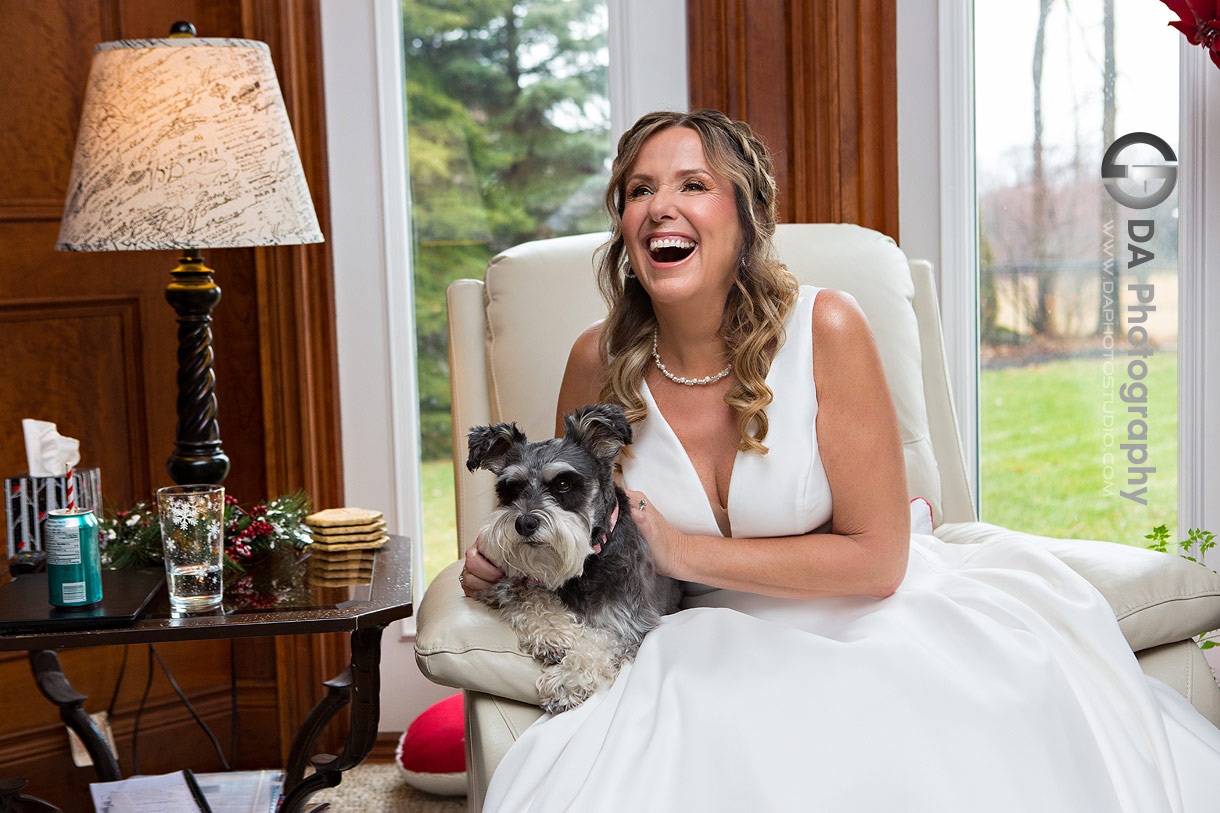 Candid photo of bride on her wedding day with her dog