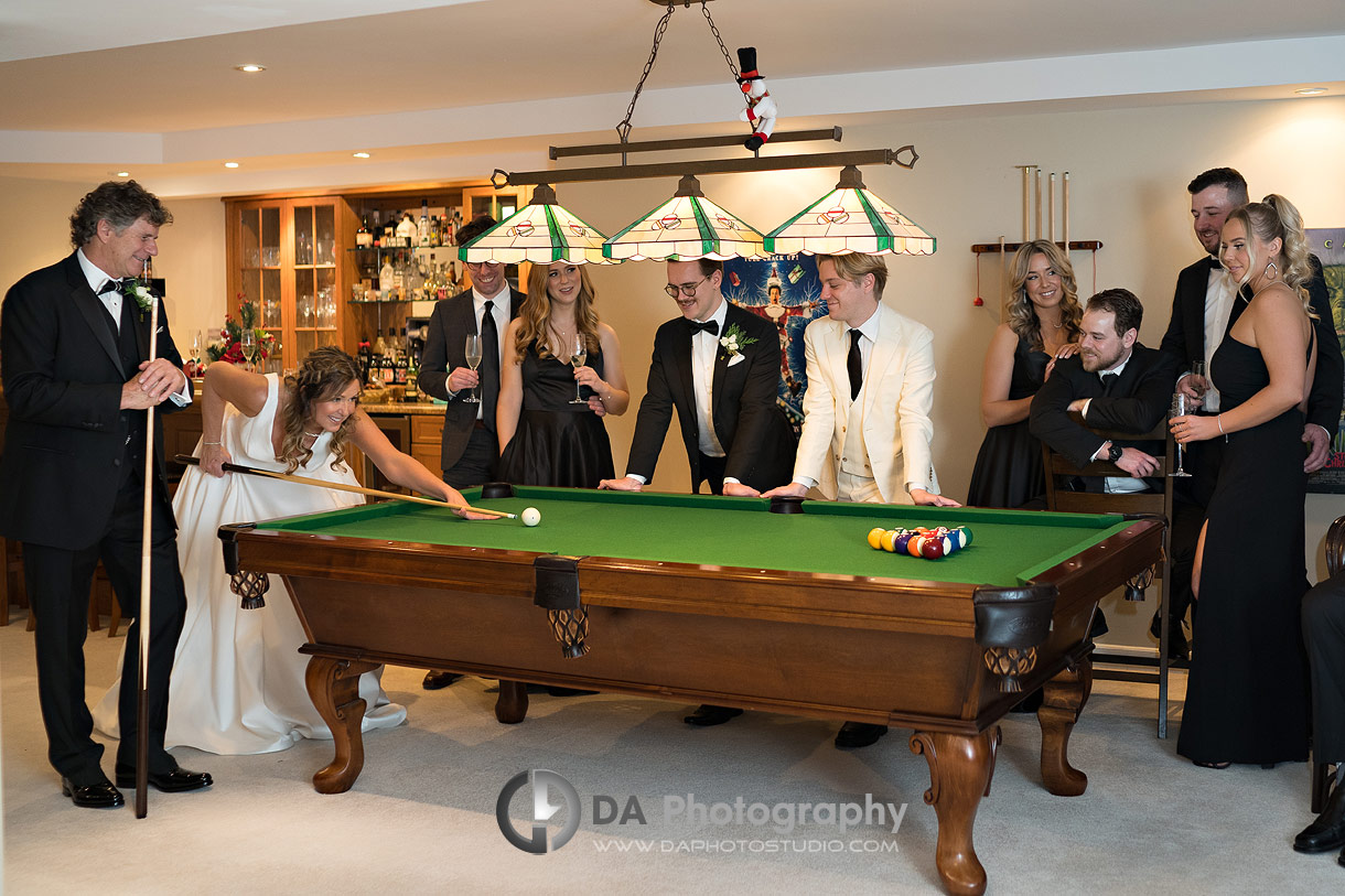 Photo of a wedding party playing pool