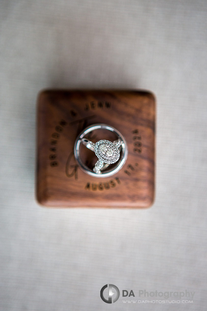 Photo of a wedding rings on a wooden box