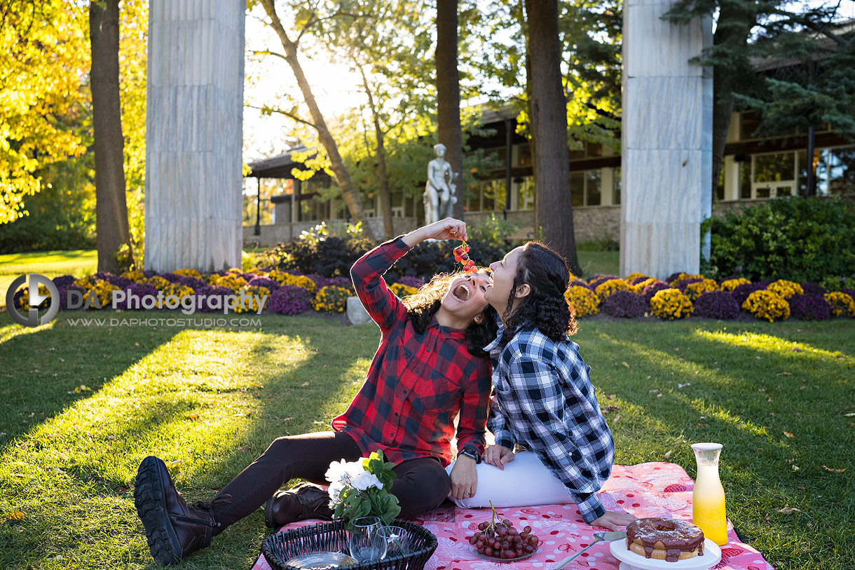 Fun Picnic photo of same sex couple during golden hour