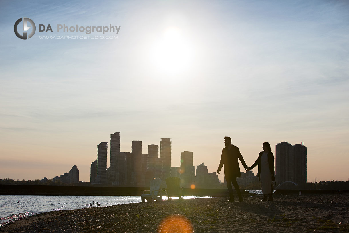 Silhouettes of engagement couple at the beach