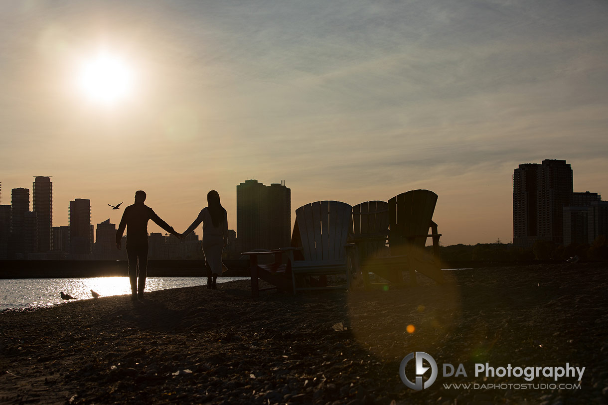 Silhouettes of a engagement couple at sunset