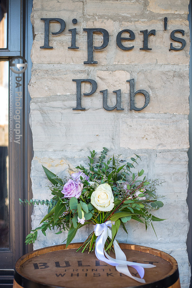 Wedding Flowers Photo on a wooden barrel at Piper's Heath in Milton