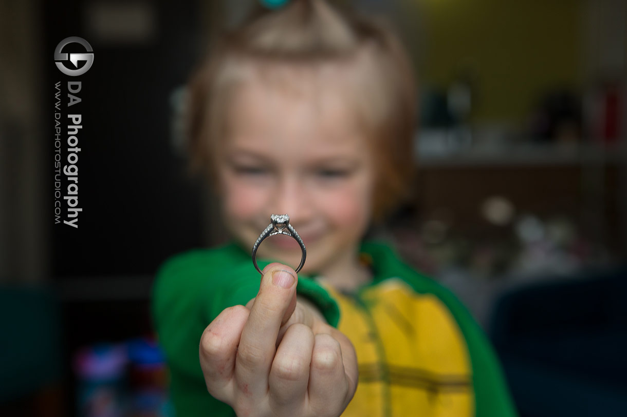 Photo of a ring-bearer holding a engagement ring