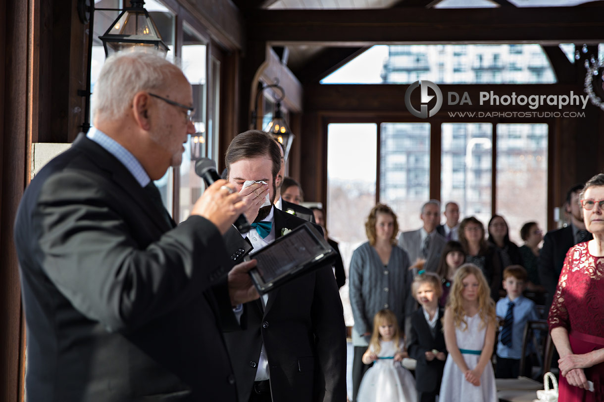 Emotional photo of a Groom wiping his tears at Cambridge Mill Wedding Ceremony