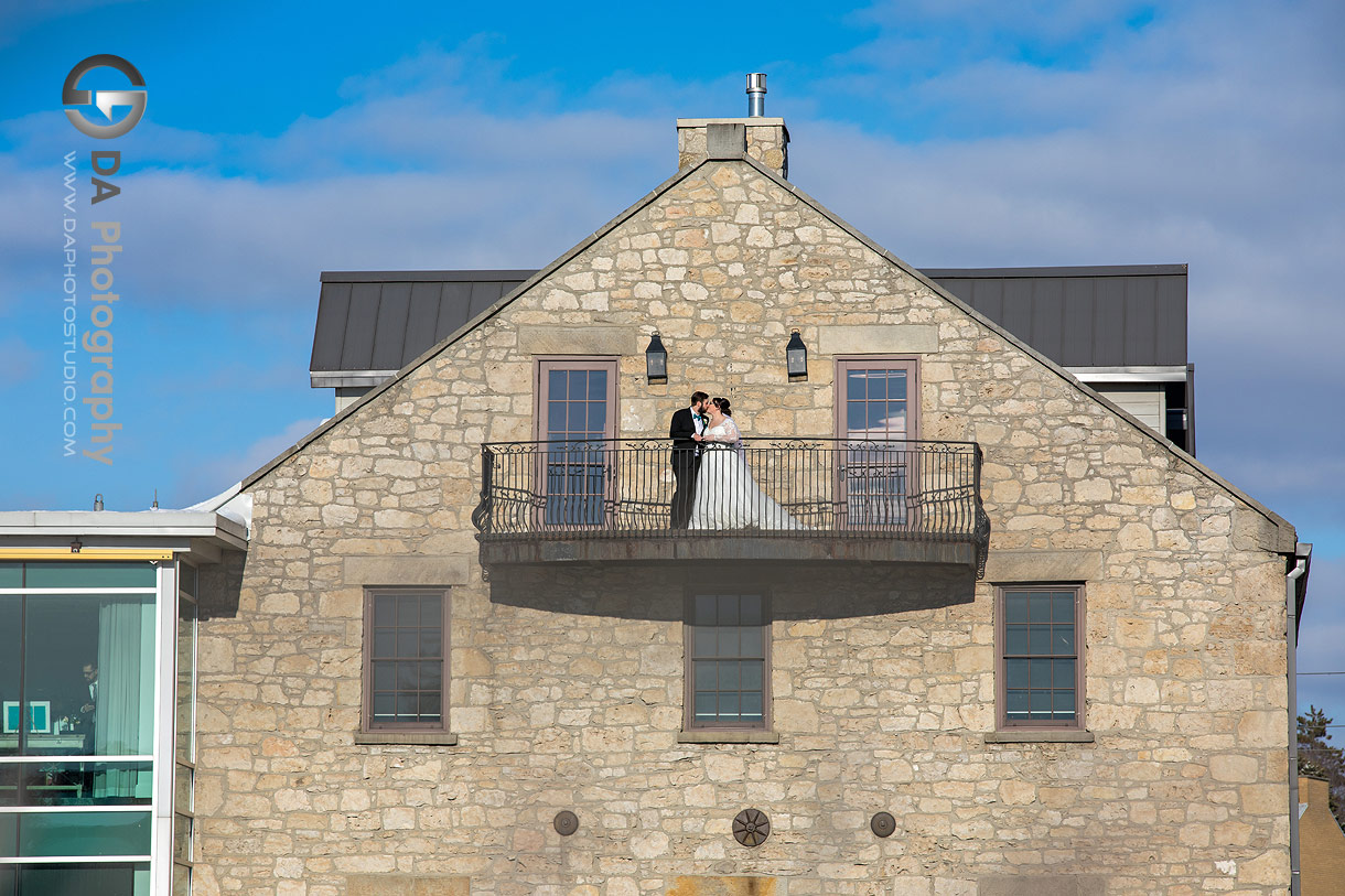 Photo of a Bride and Groom on the balcony at Cambridge Mill