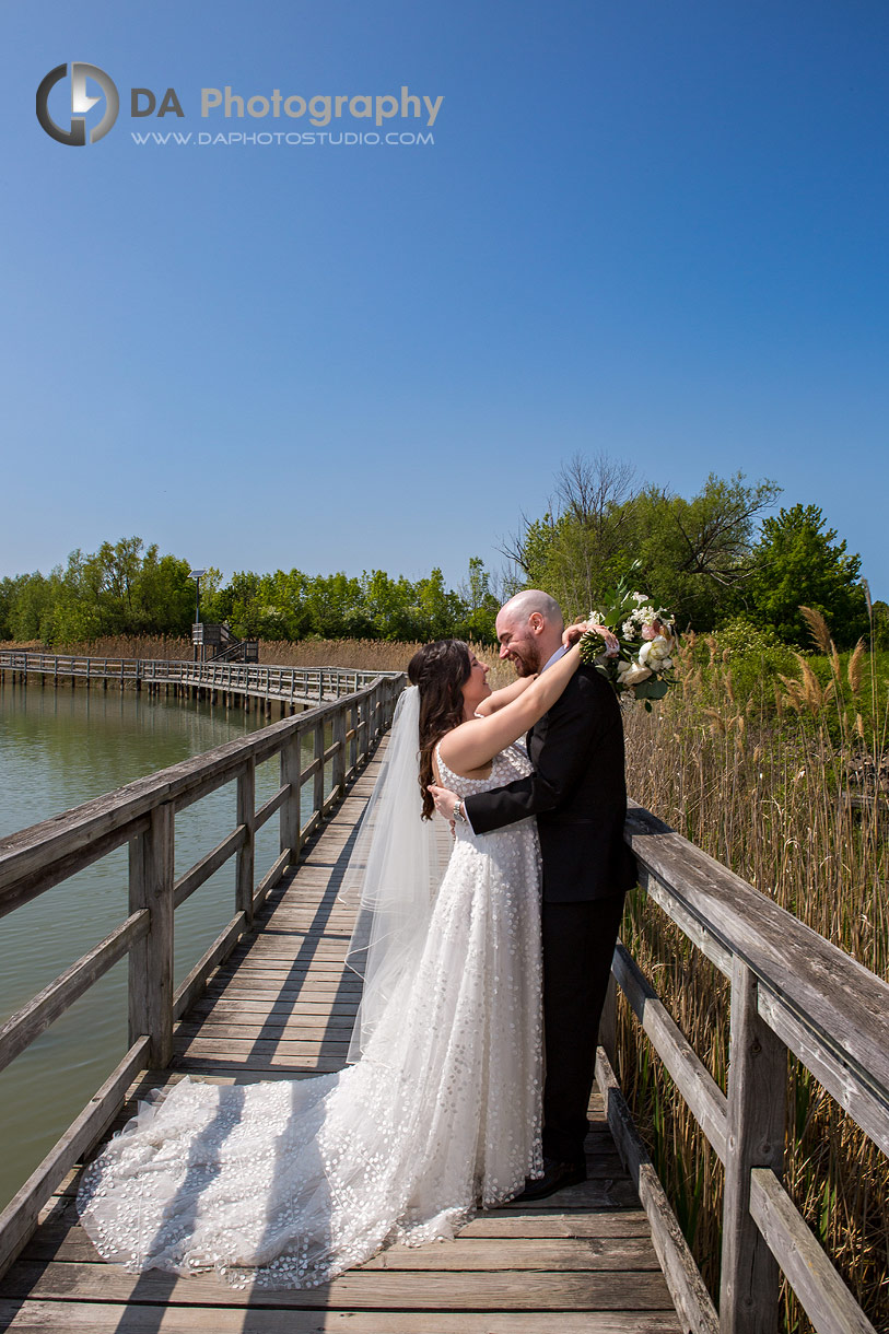 Wedding photos of bride and groom at the boardwalk in Thorold