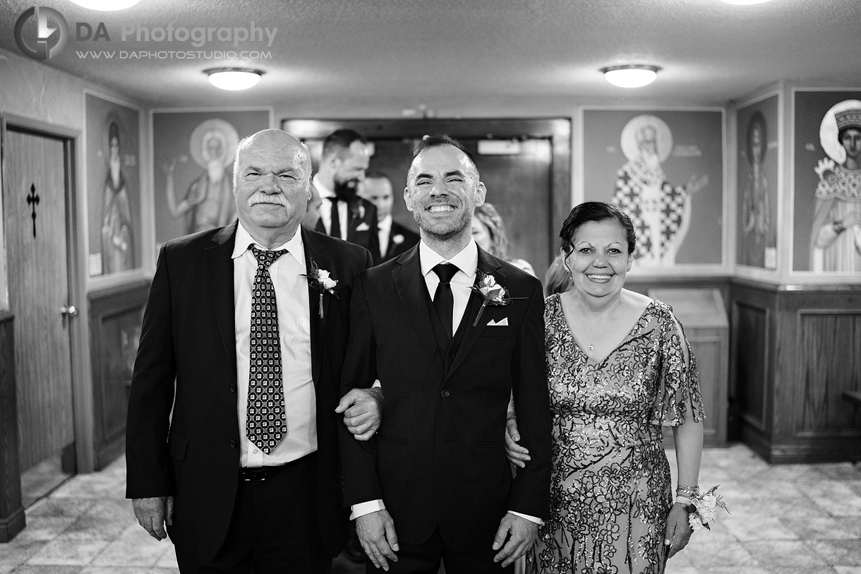 Photo of a groom with his parents at St. Clement of Ohrid Macedonian Orthodox Cathedral