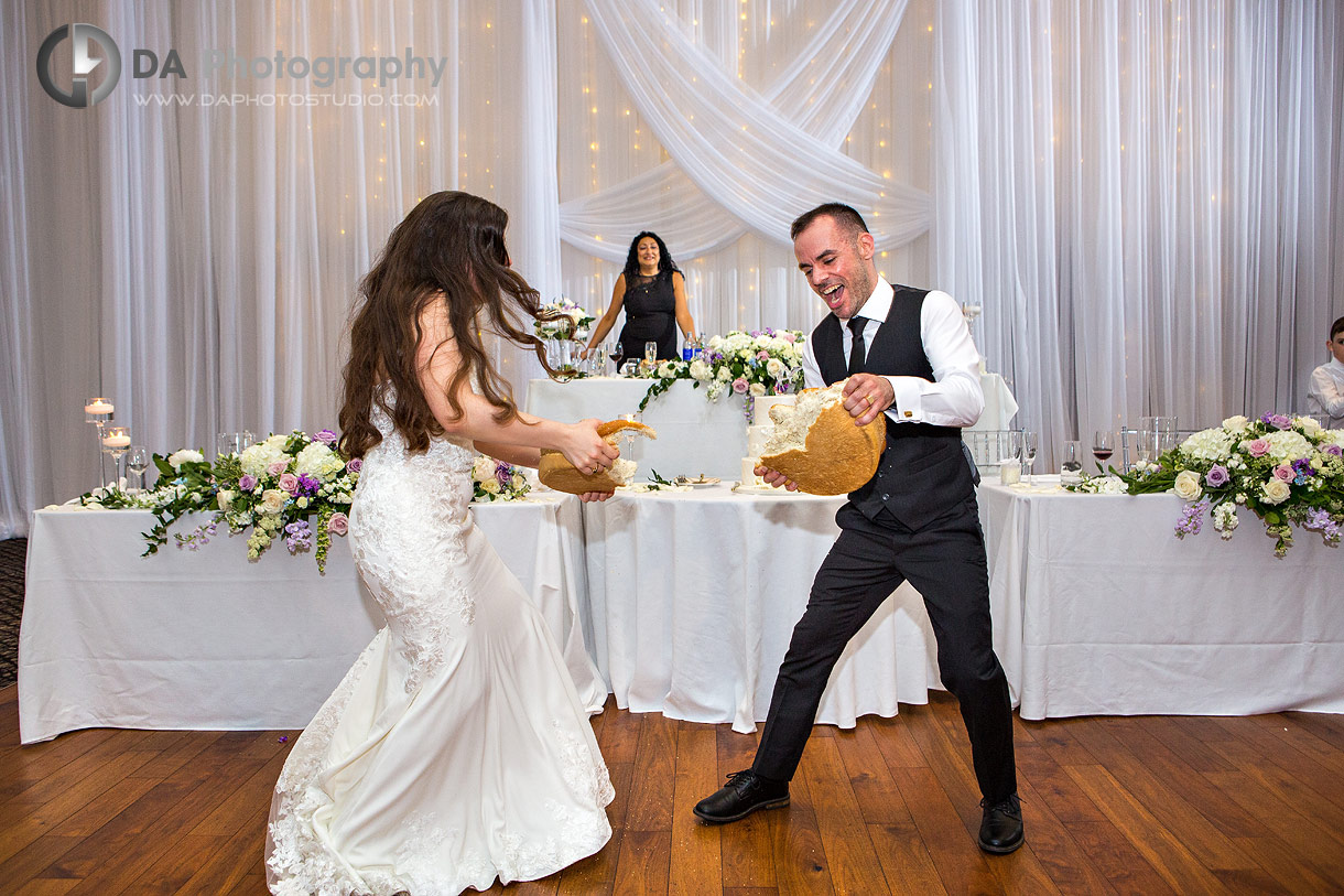 Photo of a Macedonian wedding tradition of the breaking the bread between bride and groom